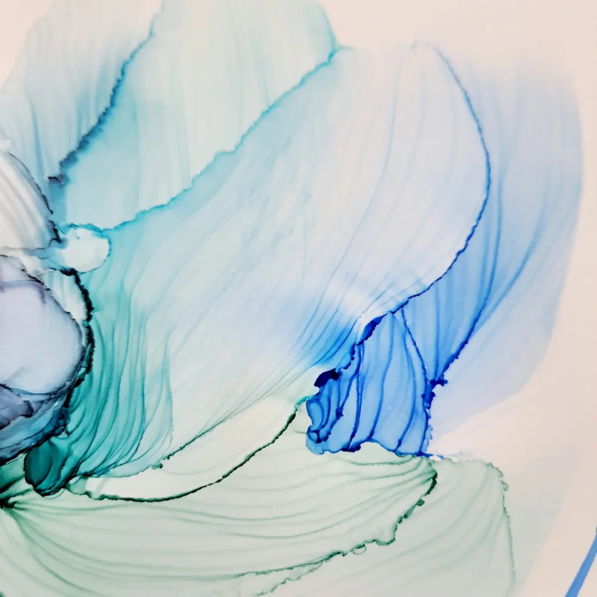 Close-up of blue and turquoise alcohol ink